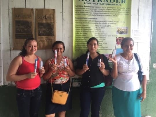 women receive toothpaste and toothbrushes for their families for participating Grid7