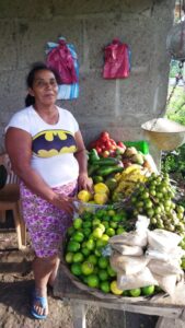 Photo of Carla showing her products in her home