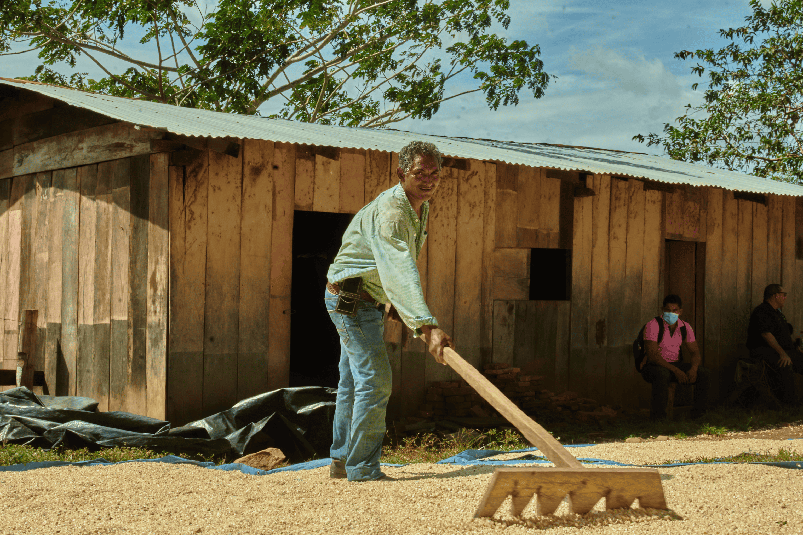 a man holding a rake