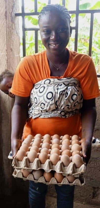 Zakiya_holding two crates of eggs