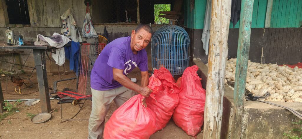 "Being A Farmer Is My Passion" 1 Adán with his corn harvest.