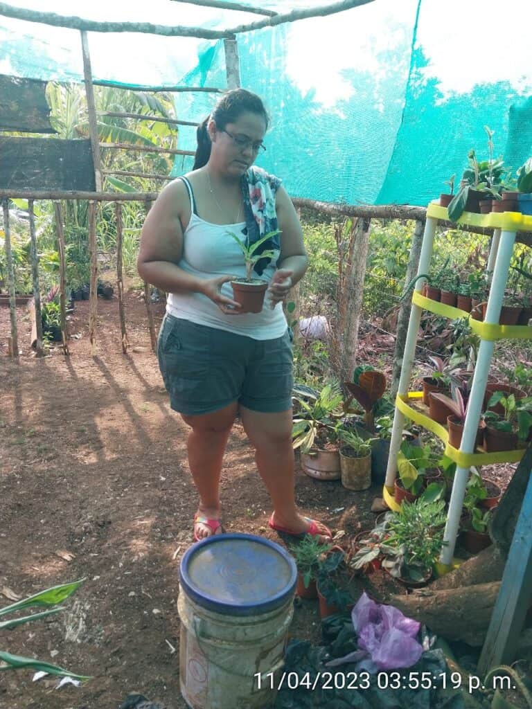Heydi tending to her plants.