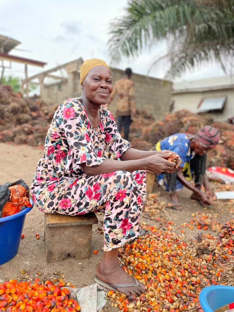 Gladys with palm fruits