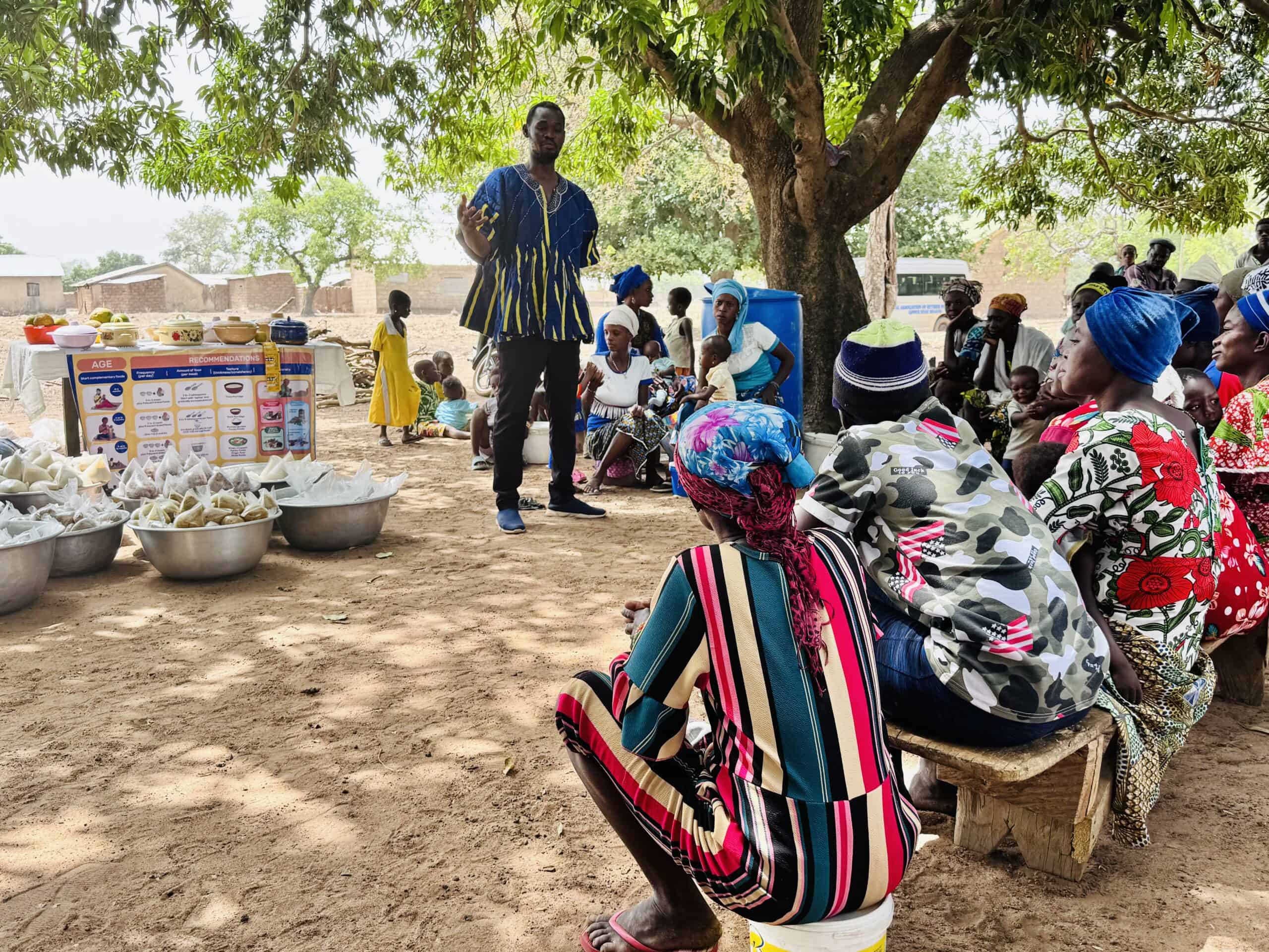 Denis Tankpaa, Self-Help International Upper West Region Promoting Good Nutrition Programs Officer, leads a food demonstration in Kogri Central, in the Ullo Traditional Area of Upper West, Ghana.