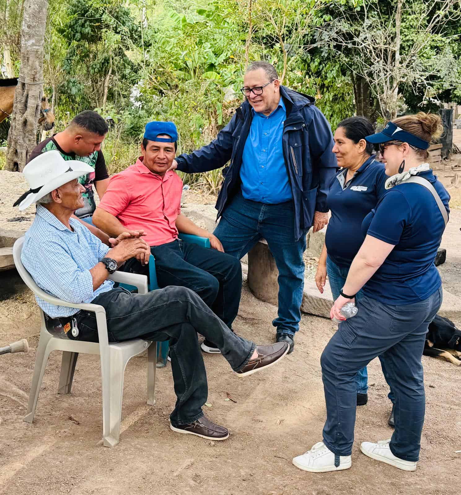 Jorge Luís Campos Solís (center), Nicaragua Country Director; Lucía Vega Galeano, Program Operations Manager; and Nora Tobin, Executive Director, meet with farmers Basilio and Francisco in El Hato, Nicaragua.