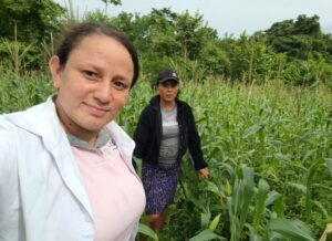 Aracelly, Self-Help International Women's Empowerment Program Officer, pays a visit to María.